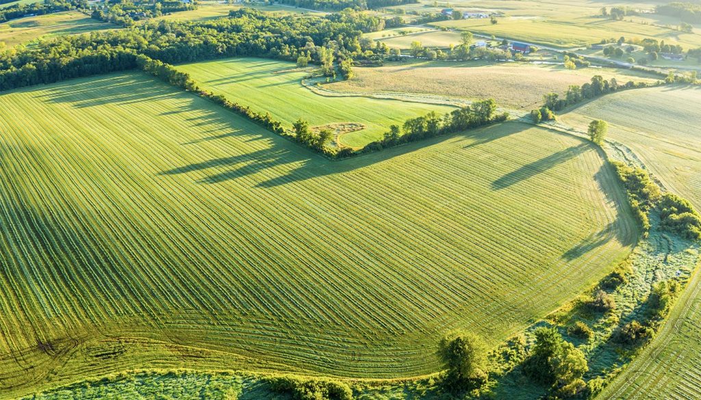 To prepare land for farming is the first step to a good farm. Image shows stunning aerial farmland.
